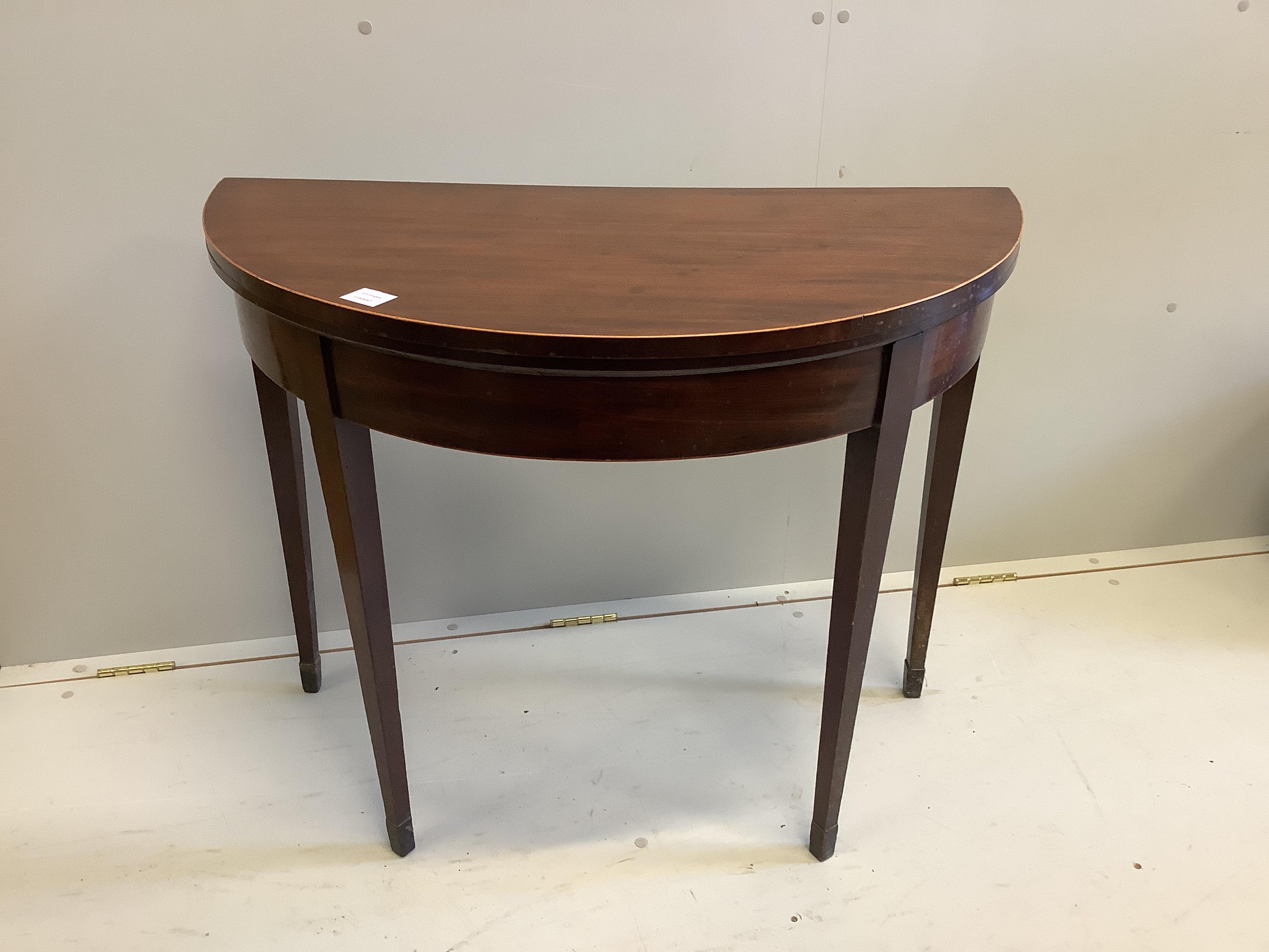 A George III mahogany D shaped folding card table, width 91cm, depth 45cm, height 74cm